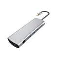 Grey aluminium USB-C docking station with HDMI, VGA, USB ports and a short connecting cable