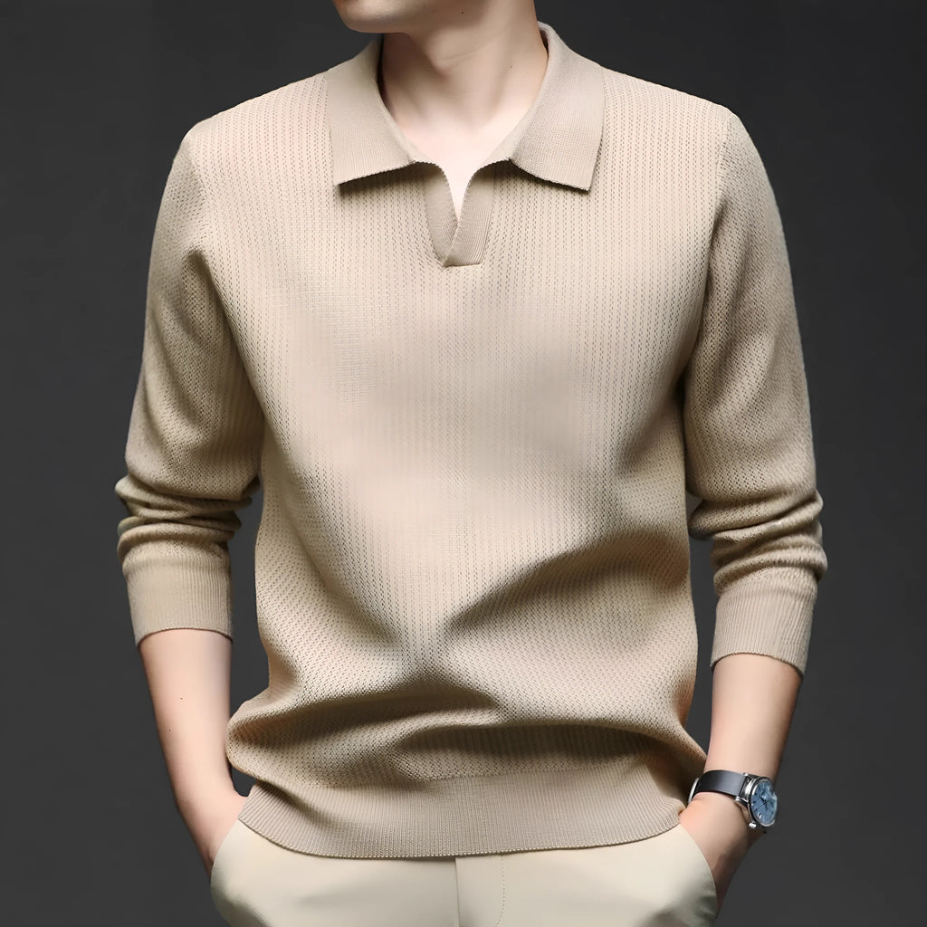 Men's loose green pullover sweater on a hanger, casual autumn wear.