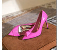 Women's pink pointed toe stiletto high heels with patent leather uppers and ankle buckle detail