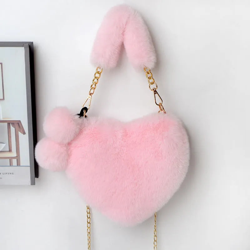 Heart-shaped women's plush handbag with soft texture and detachable shoulder strap in medium size