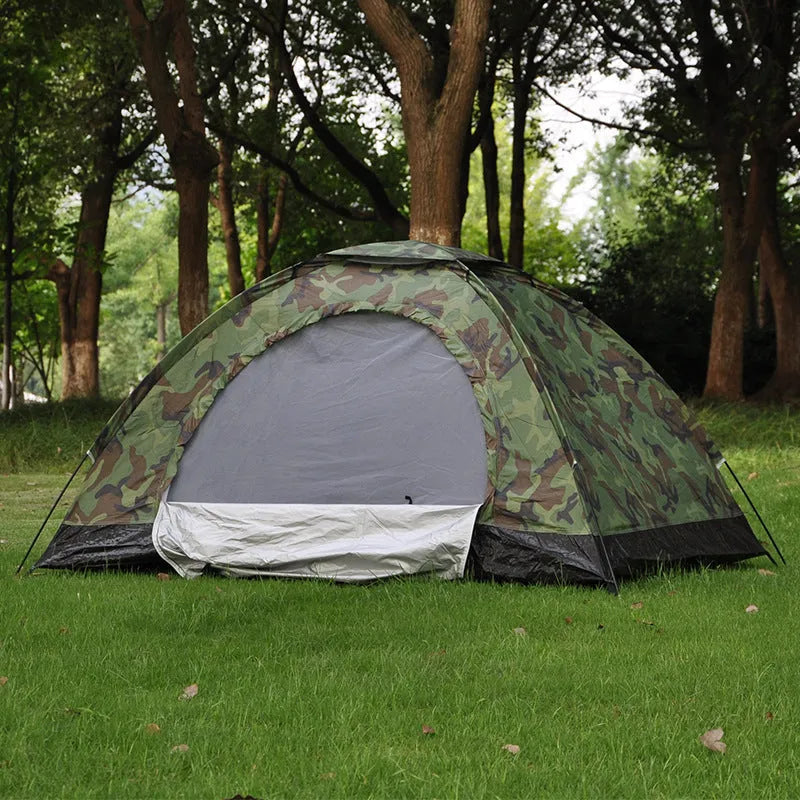 Green camouflage two-person camping tent with mesh windows and steel ground nails