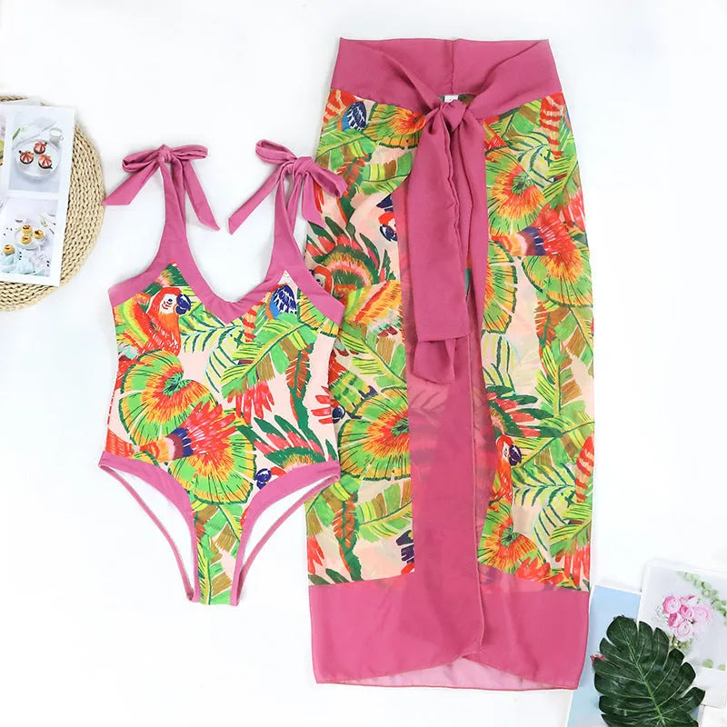 Women's pink floral print retro one-piece swimsuit with V-neck and matching skirt