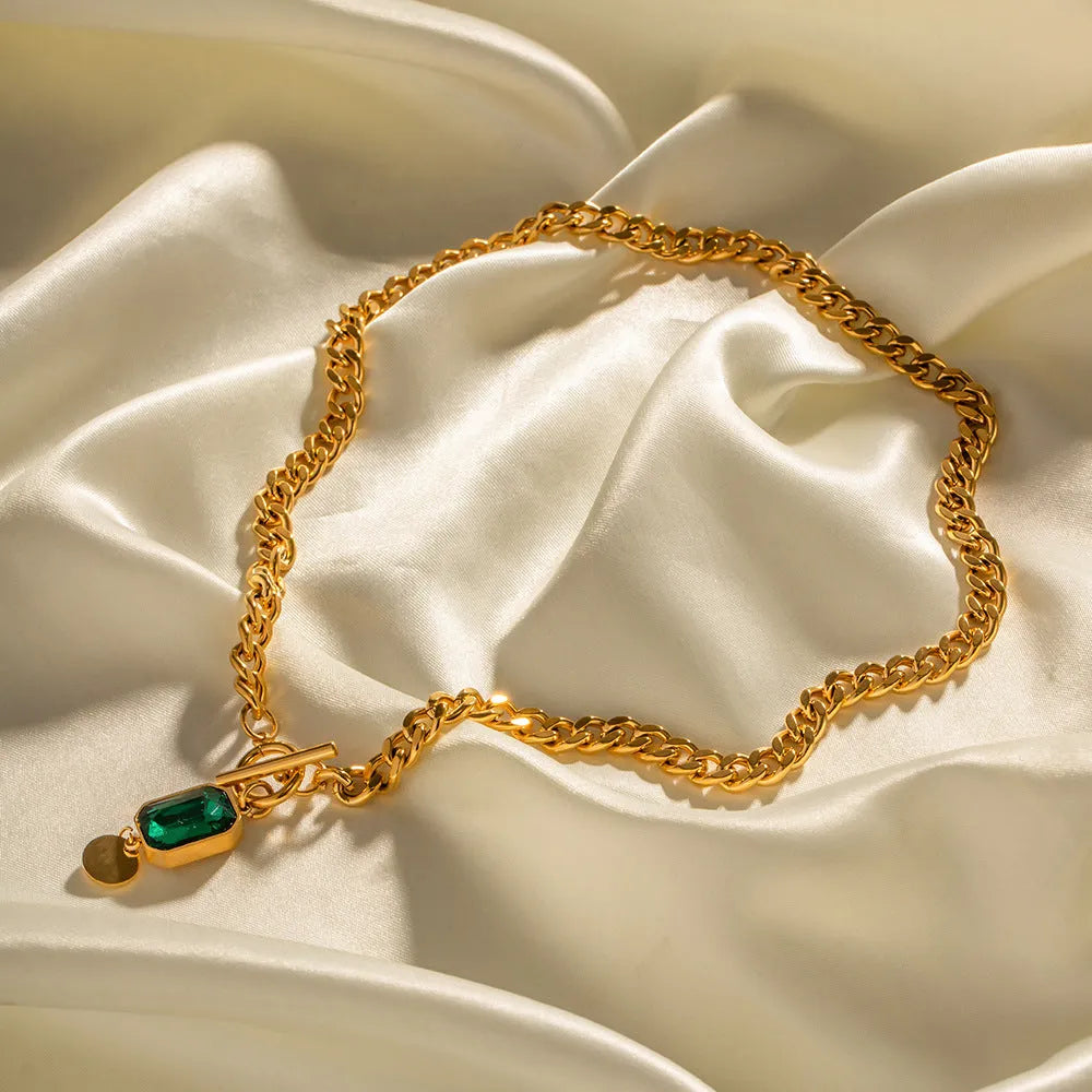 Gold electroplated titanium steel necklace with emerald zircon pendant and Cuban link chain