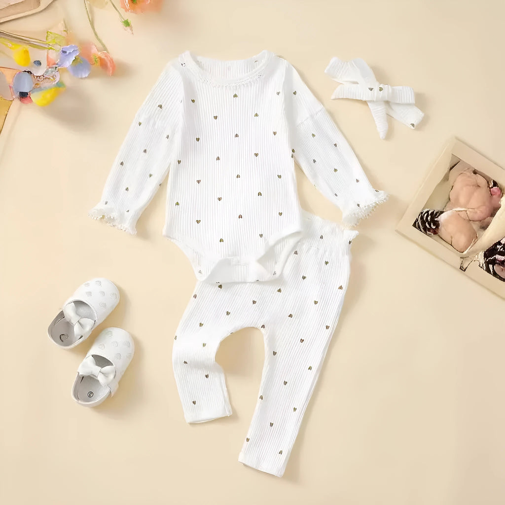 White cotton baby suit three-piece set with top, long pants, and hair tie showing sunken stripe stitching