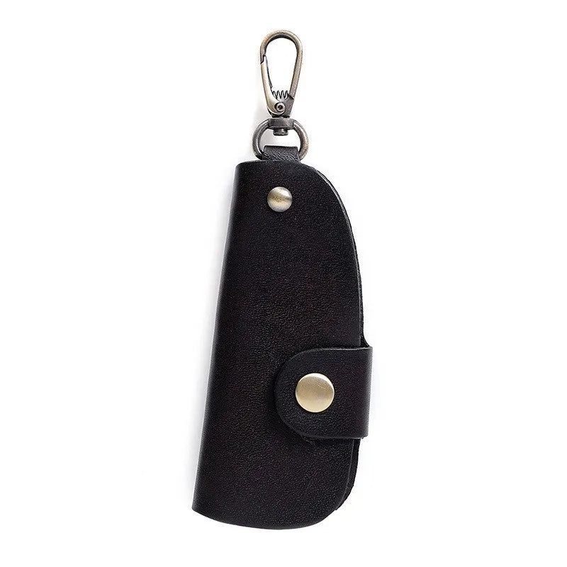 Handmade genuine leather key case for car keys in short length on a table
