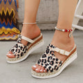 Women's leopard print wedge platform sandals with a fish mouth toe on a rubber sole.