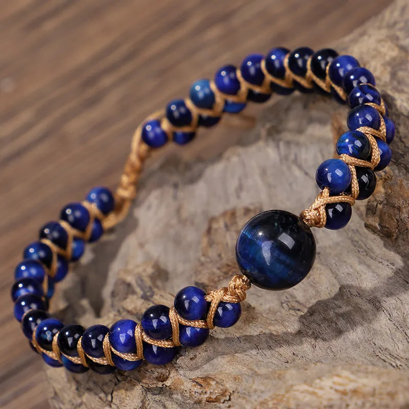 Handmade woven pull bracelet with tigereye and amethyst beads in geometric pattern