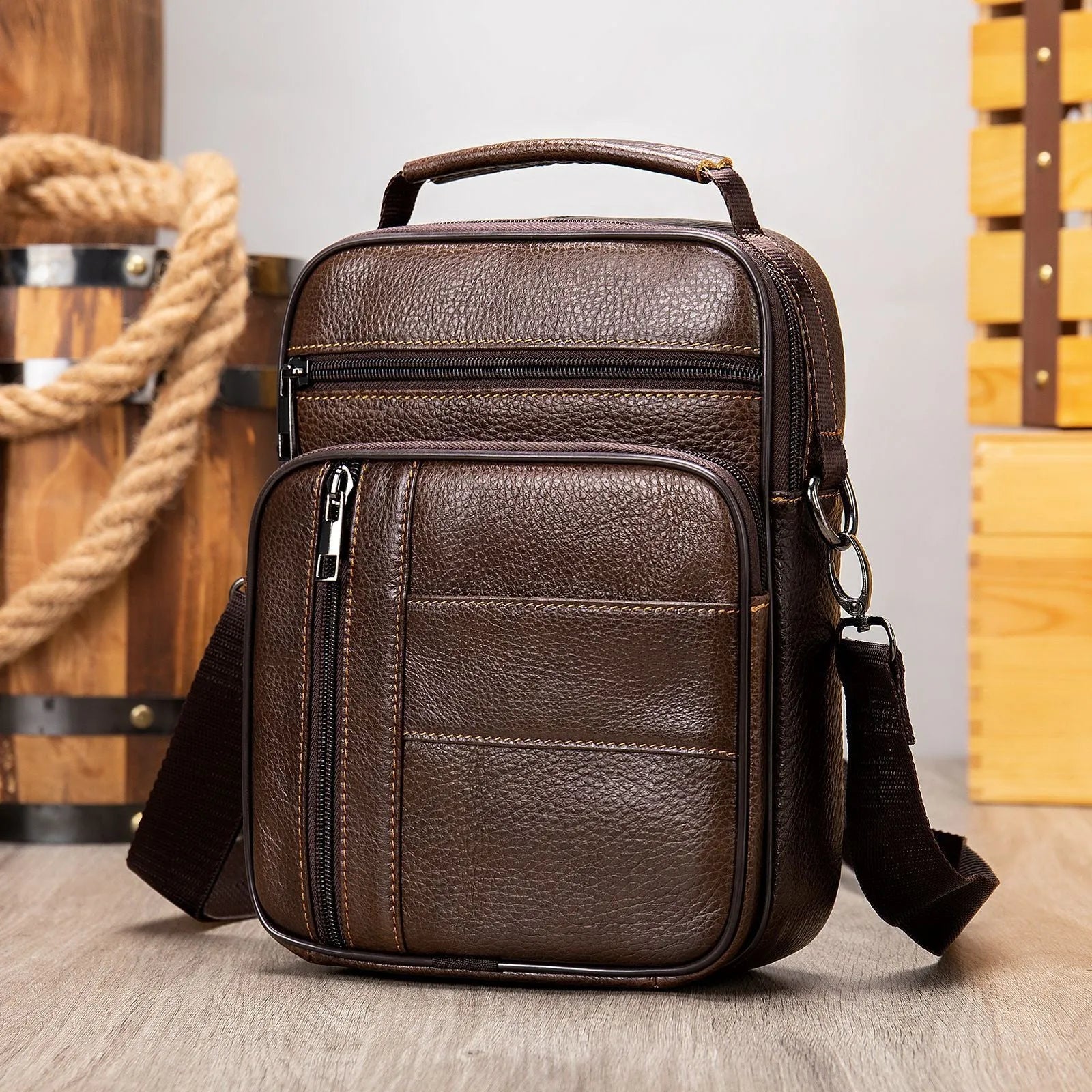 Vintage style genuine leather men's shoulder bag in vertical square shape showing internal organiser pockets
