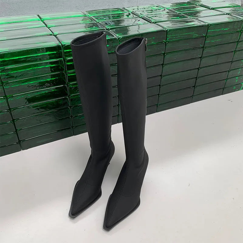 Black pointed toe below the knee stiletto heel boots with a back zipper fastening.