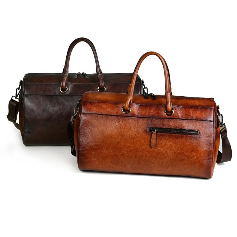 Handmade retro style leather travel bag in vintage brown colour showing expansion functionality