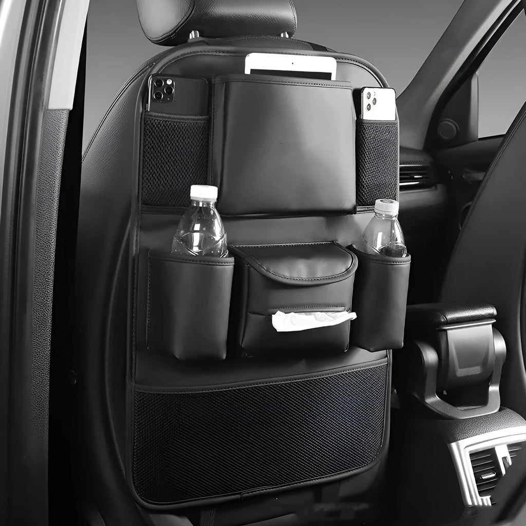 Genuine leather car seat back storage bag shown in grey, suspended behind a car headrest.