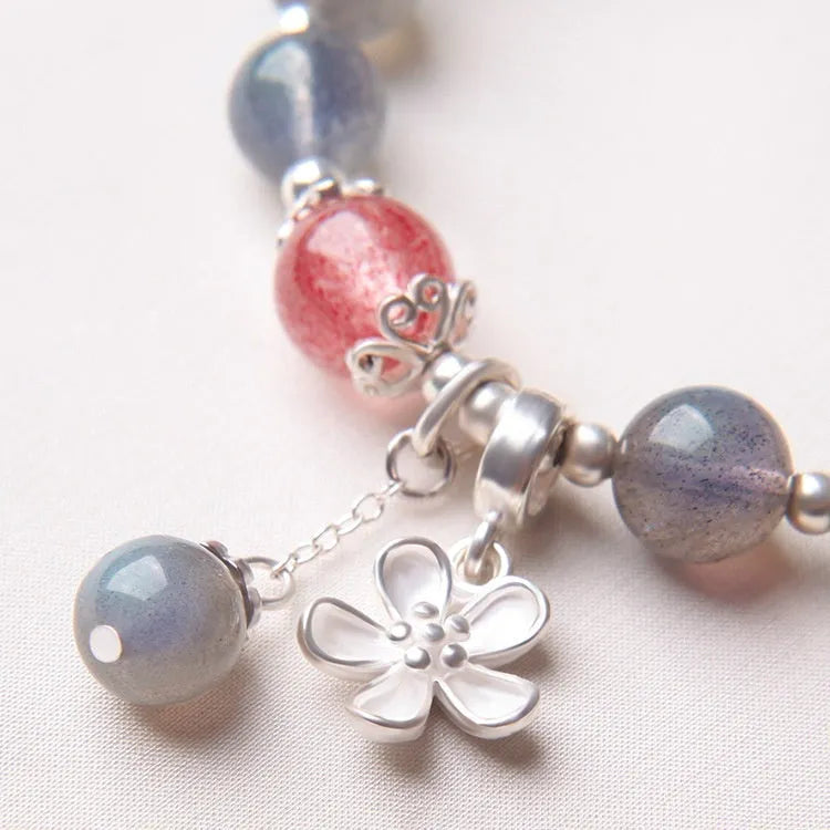 Women's moonstone bracelet with 7.5mm grey stone, red quartz accents and sterling silver