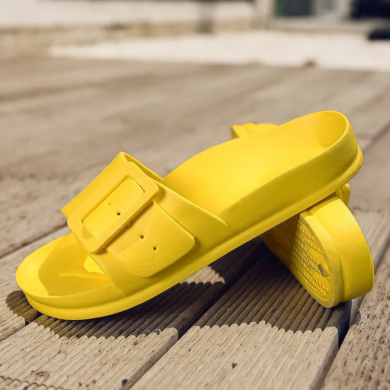 Women's grey blue buckle fastening flip-flop sandals with soft EVA sole on a white background.