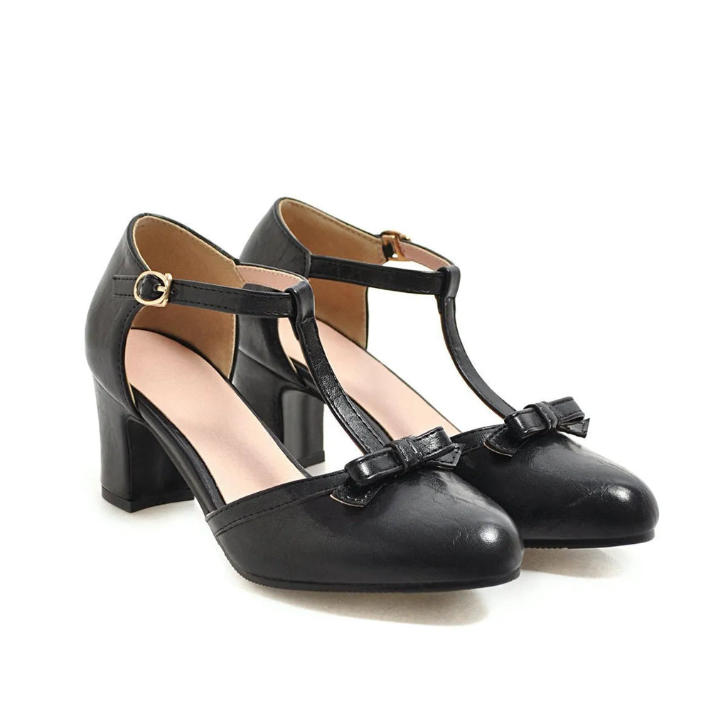 Women's solid colour sandals with chunky 6.5cm heel, buckle strap, and bow detail