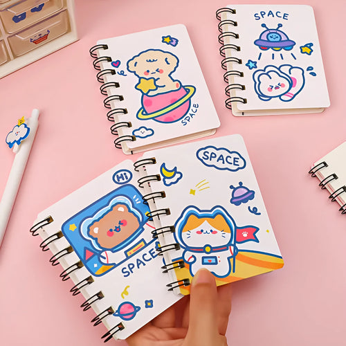 Astronaut-themed flipper notebook measuring 10.5cm by 8cm with space design cover options