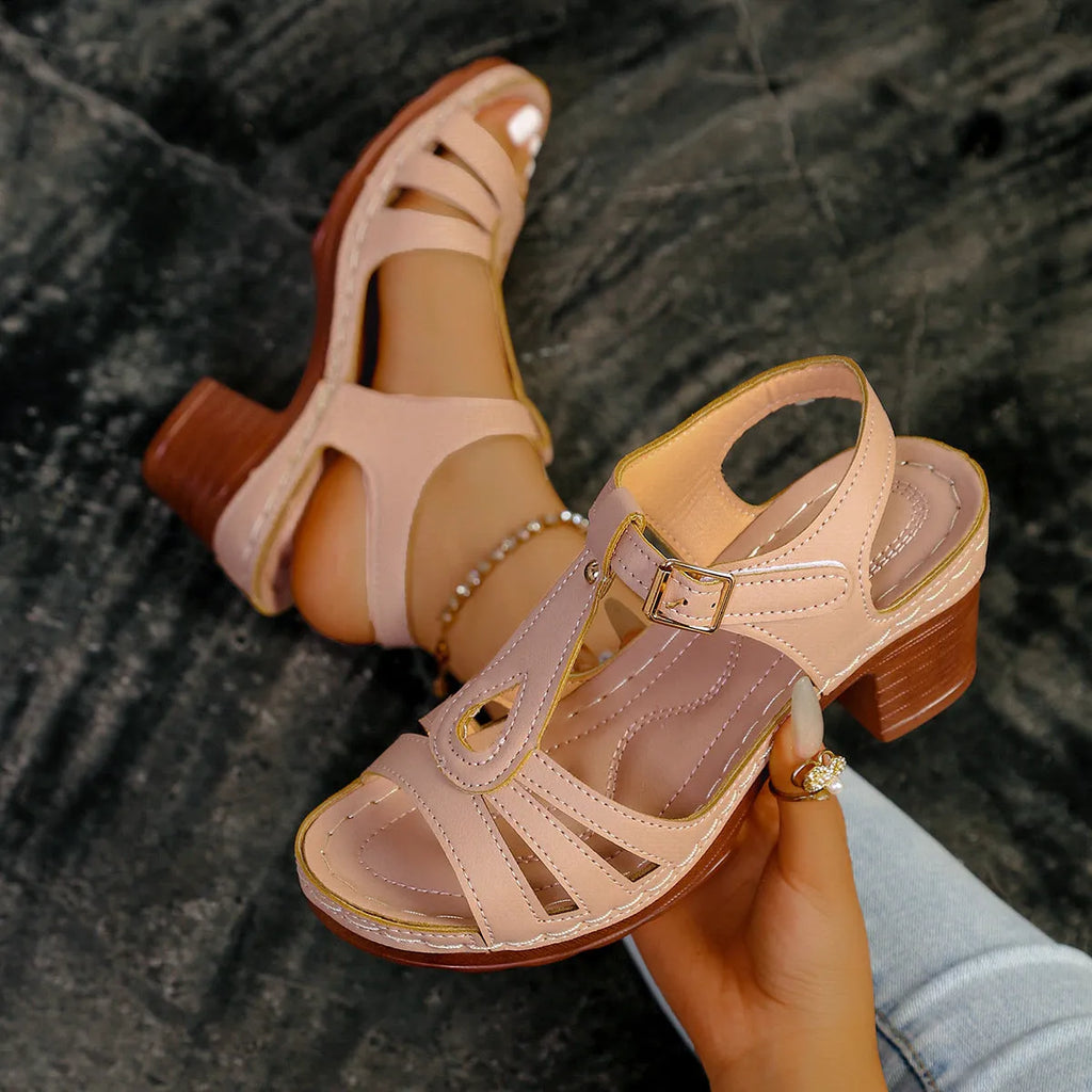 Women's black peep toe wedge sandals with a buckle fastening and platform sole.