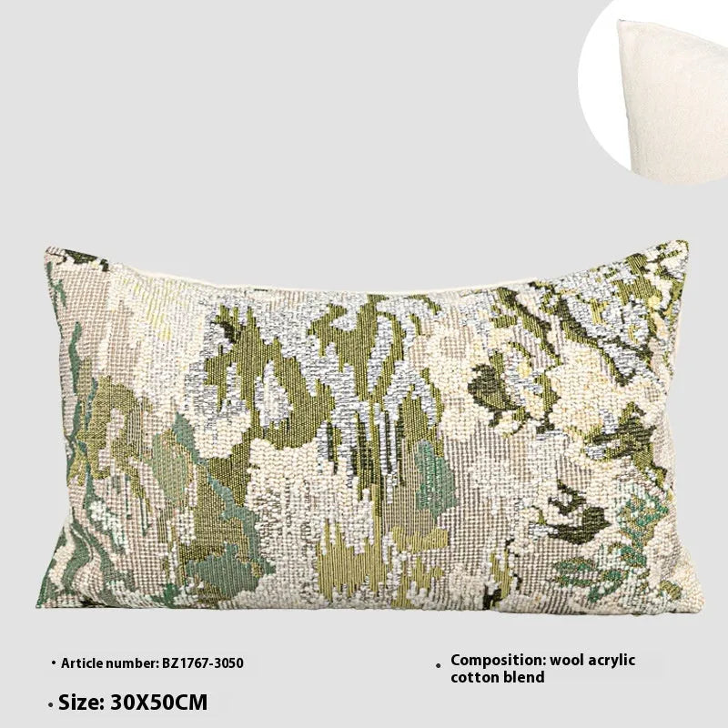 Green abstract floral wool blend decorative cushion on a neutral background.