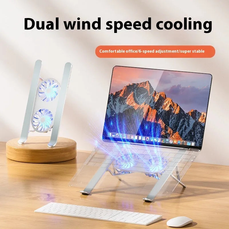 Silver aluminium laptop stand with twin fans raised at an angle on a wooden desk.
