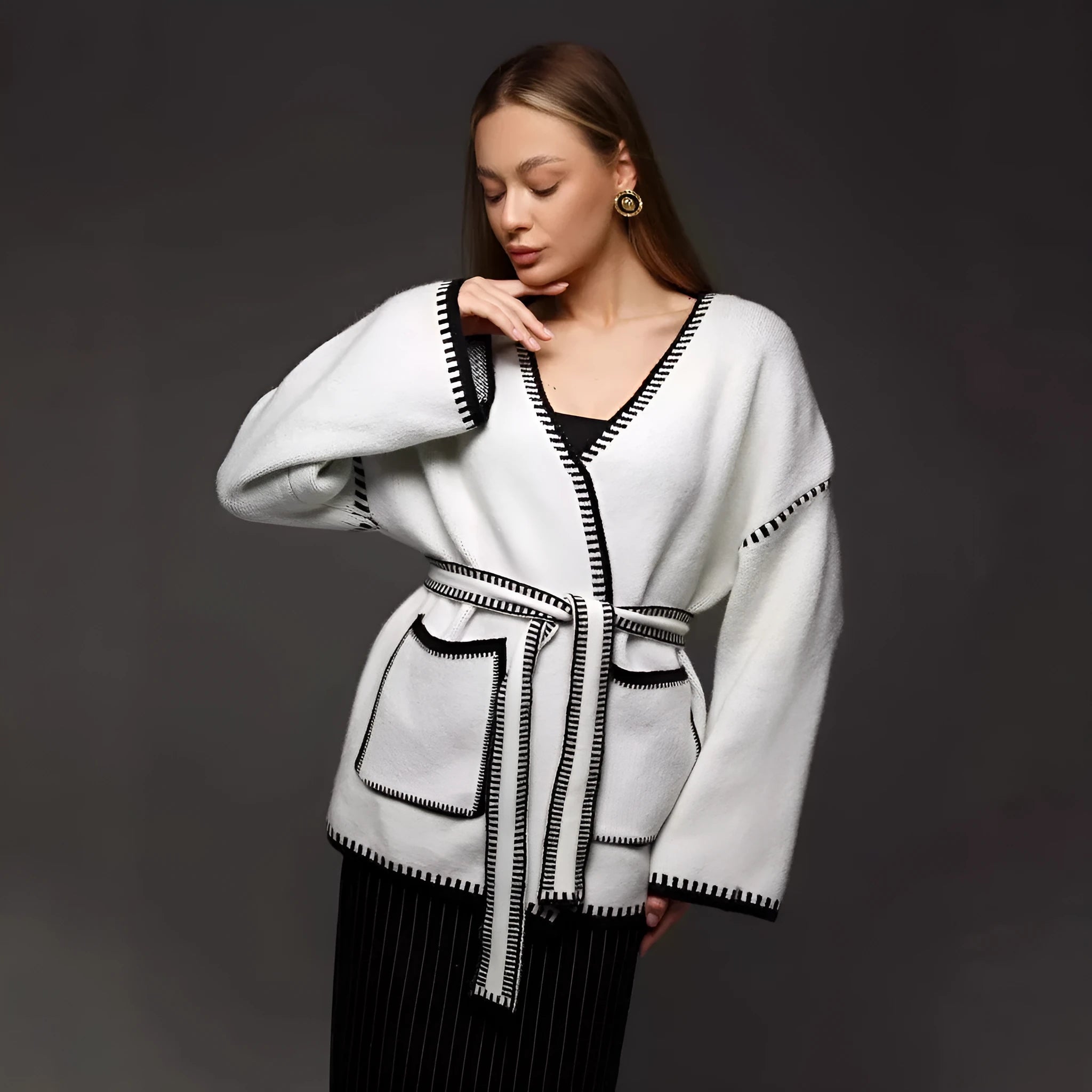 Lace-up front knitted cardigan in imitation cashmere fabric showing loose fitting design and long sleeves