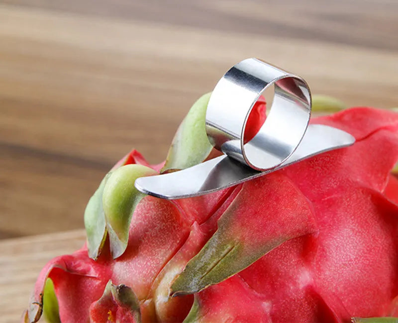 Silver stainless steel ring orange peeler on white background showing 7.5cm tool with finger ring
