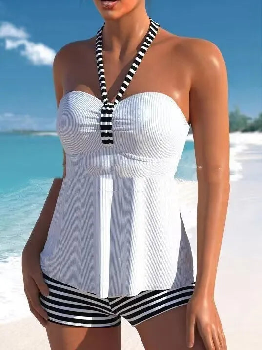 Women's solid colour striped off-shoulder one-piece swimsuit on a mannequin, showing the briefs style and removable lining.