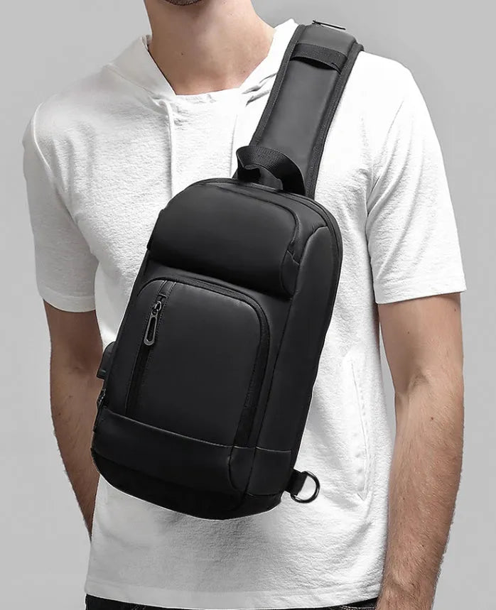 Black PVC outdoor leisure shoulder bag with internal organiser pockets and air cushion strap