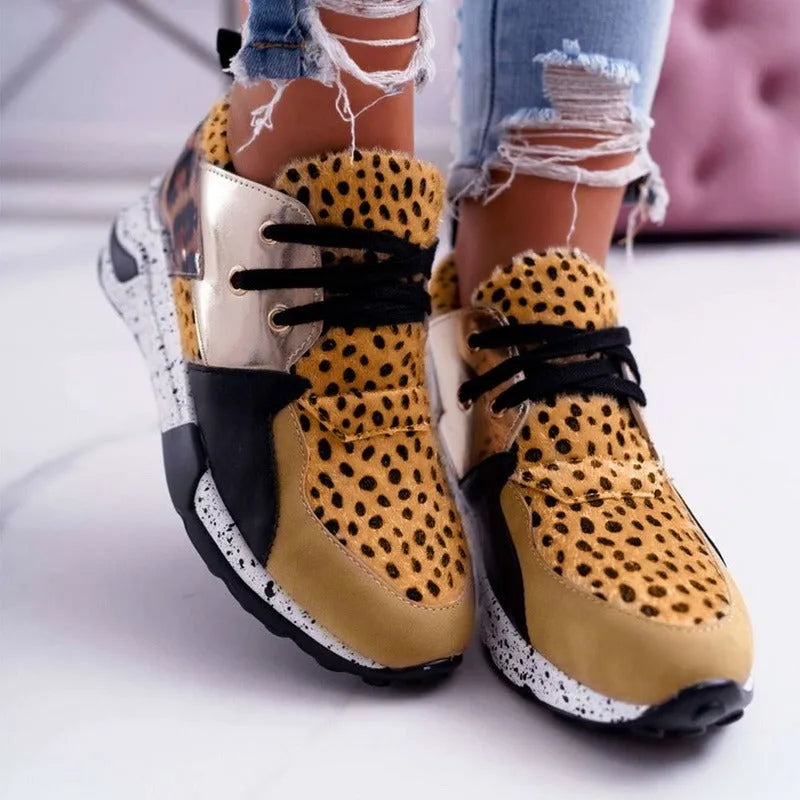 Women's black suede casual sneakers with a wedge heel on a white background