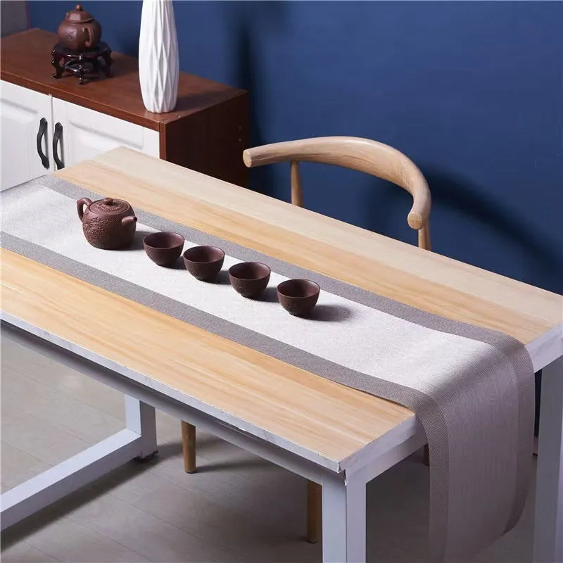 Non-slip PVC place mat in modern simple style, showing gradient bamboo black colour option on a kitchen counter.