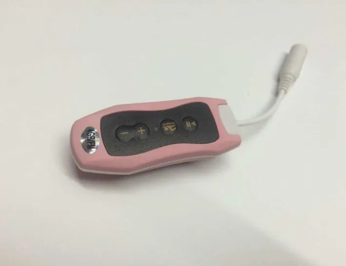 Compact black Bluetooth MP3 player with attached earphones, shown next to a USB cable.