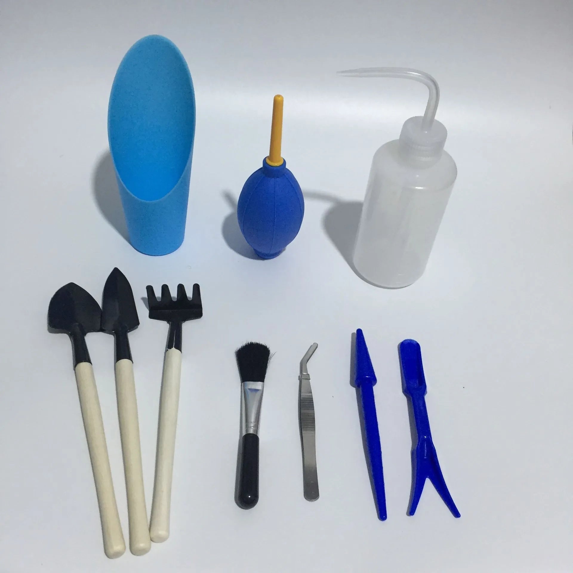 14-piece succulent gardening tool set showing miniature watering can, soil tools, tweezers and brush