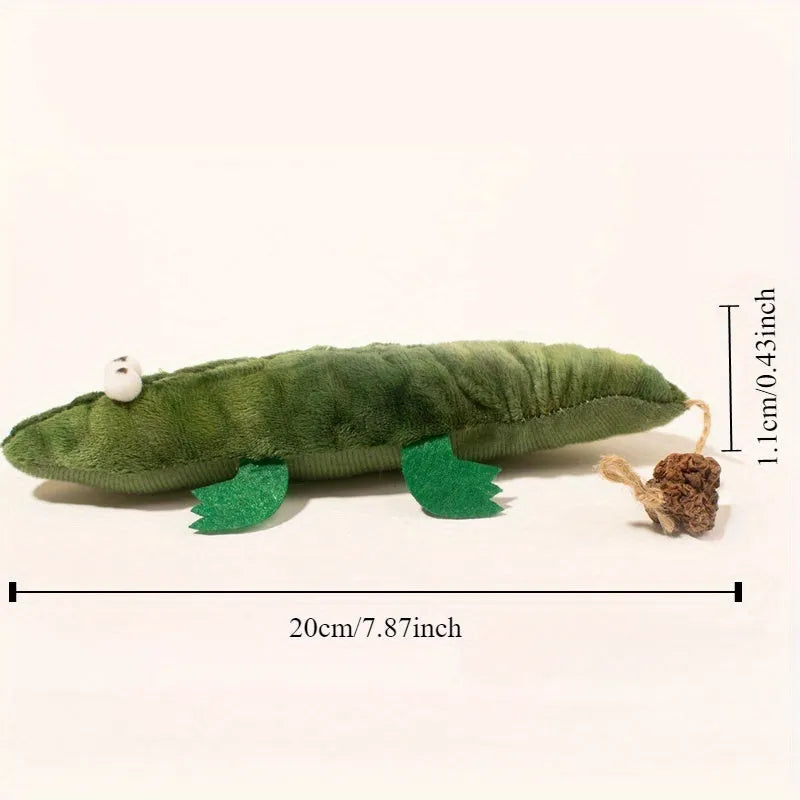 Green plush alligator catnip toy with peppermint scent on a white background.