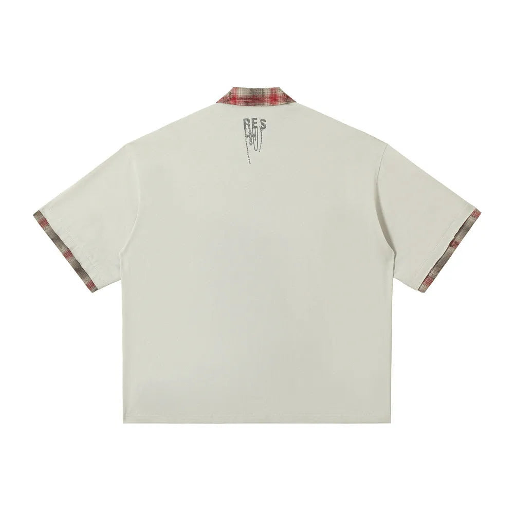 Men's loose fit cotton short sleeve top with asymmetric cut and graffiti print in blue or red