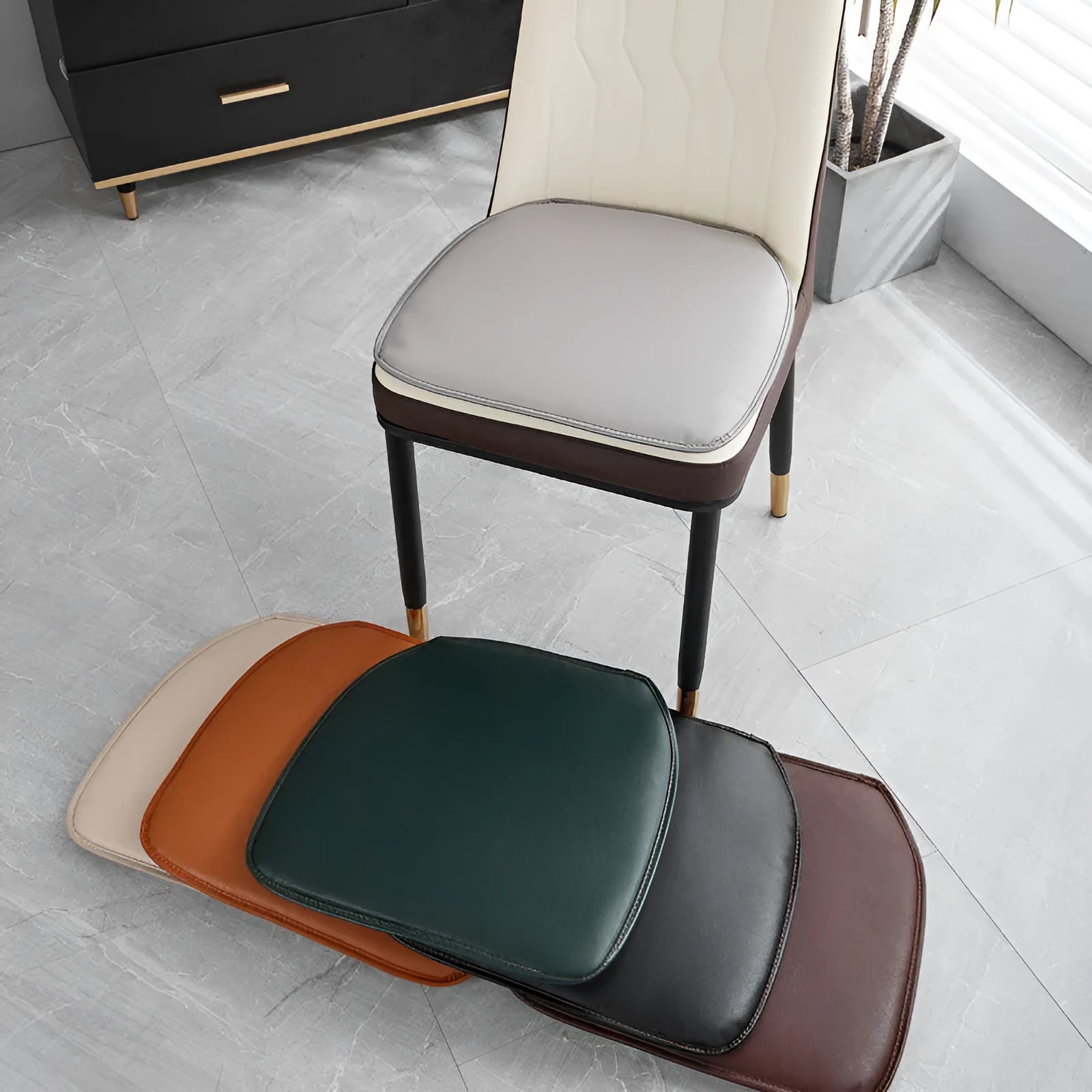 Brown leather horseshoe-shaped seat cushion with non-slip backing on a wooden chair.