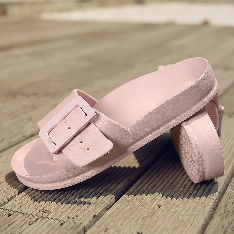 Women's grey blue buckle fastening flip-flop sandals with soft EVA sole on a white background.