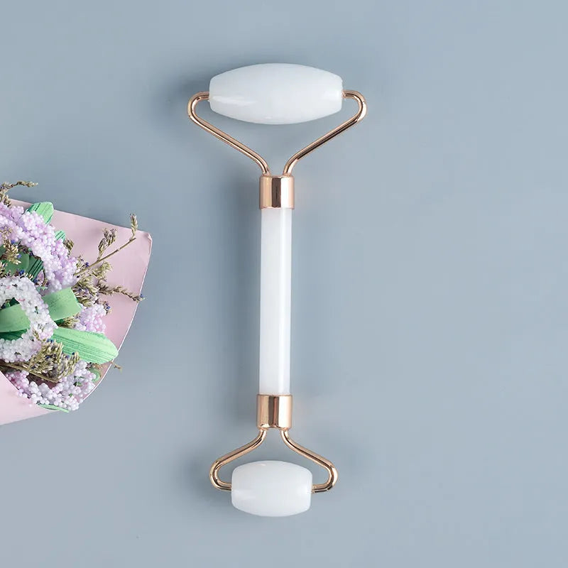 White jade facial roller and gua sha board set for skincare massage
