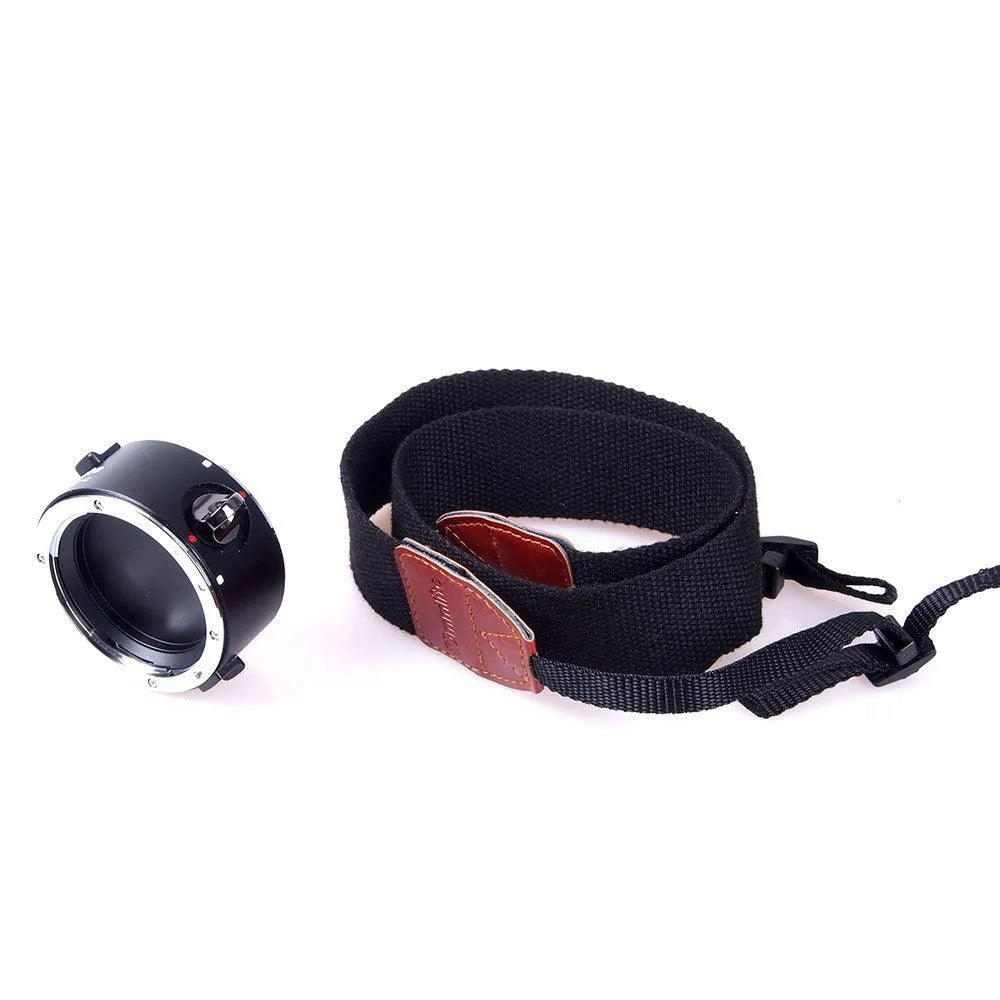 Aluminium camera lens flipper holder for Nikon with cotton shoulder strap.