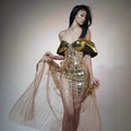Gold sequined strapless dress with tulle skirt and thigh-high split, shown on mannequin