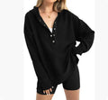 Women's loose peacock green raglan sleeve pullover sweater on a hanger.