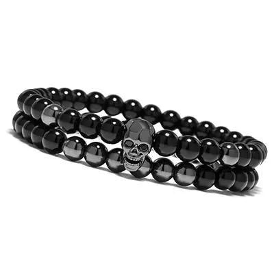 Metal smile skull bracelet in Black finish on a flat surface