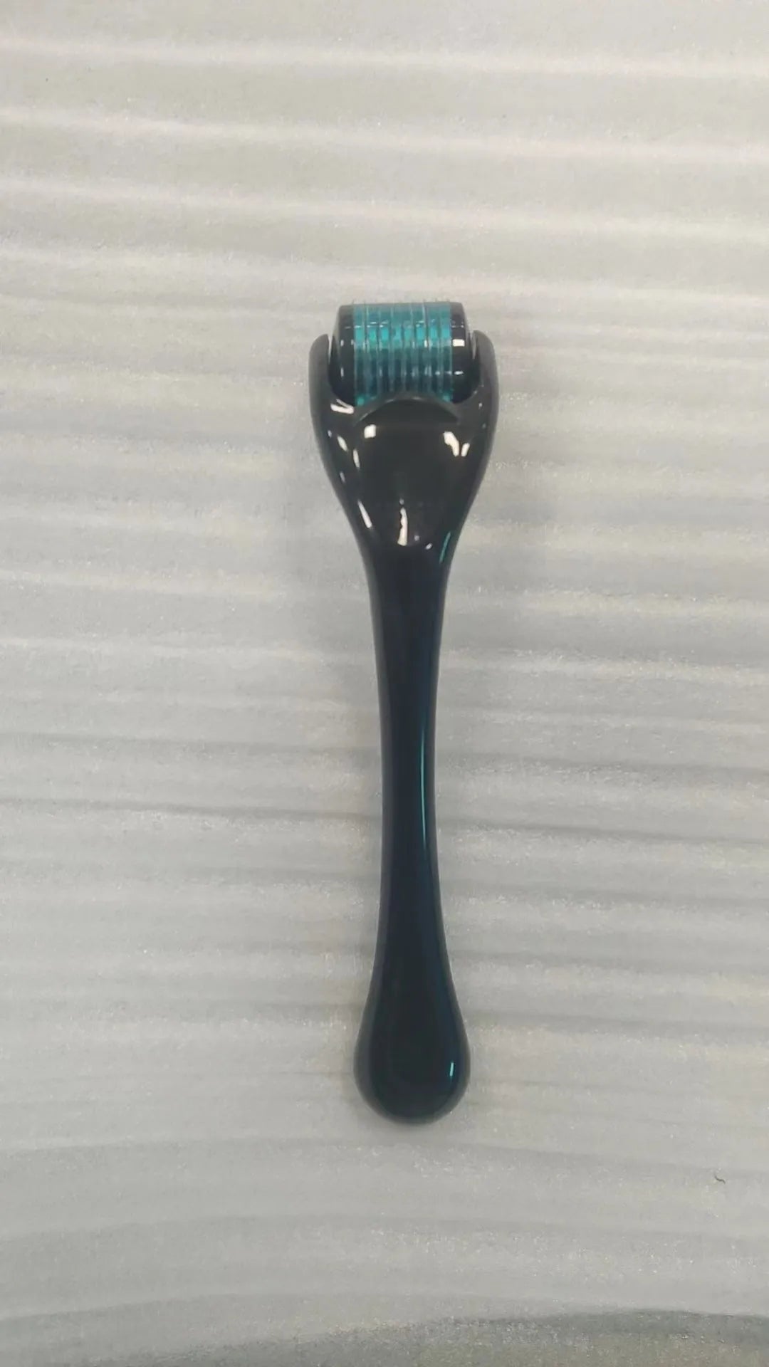 Sterile micro needle derma roller with PC handle in selected colour and 0.2mm, 0.25mm, or 0.3mm needle wheel.