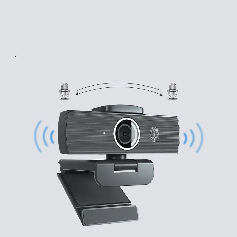 Black 8MP USB webcam with a magnetic privacy cover attached, shown next to its cable and manual.
