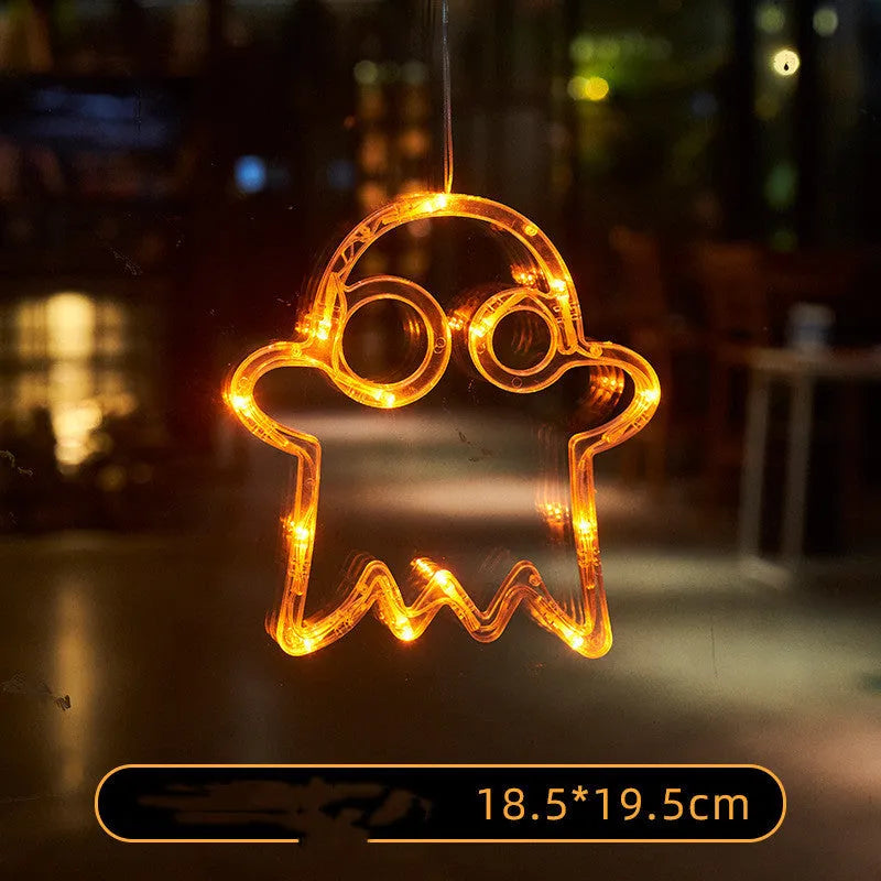 Seven Halloween-themed LED hanging lights with suction cups including spiders, pumpkins and ghosts