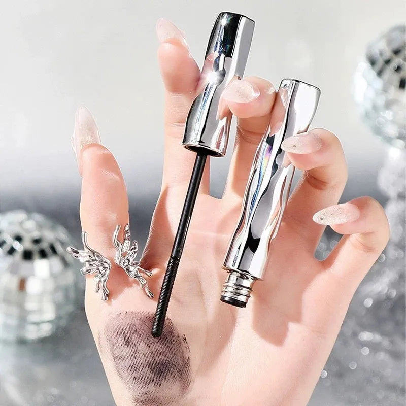 Waterproof mascara in steel tube with black and brown shades and optional eyelash curler