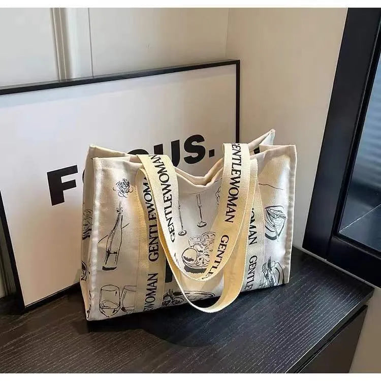 Large canvas women's tote bag with printed design, shown in available colour and pattern options