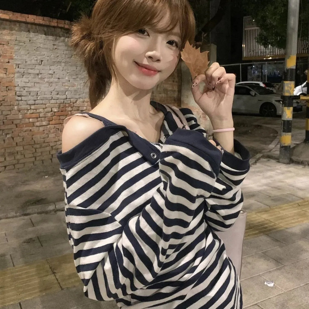 Dark blue oversized women's T-shirt with embroidery, buttons, and striped details in Korean style