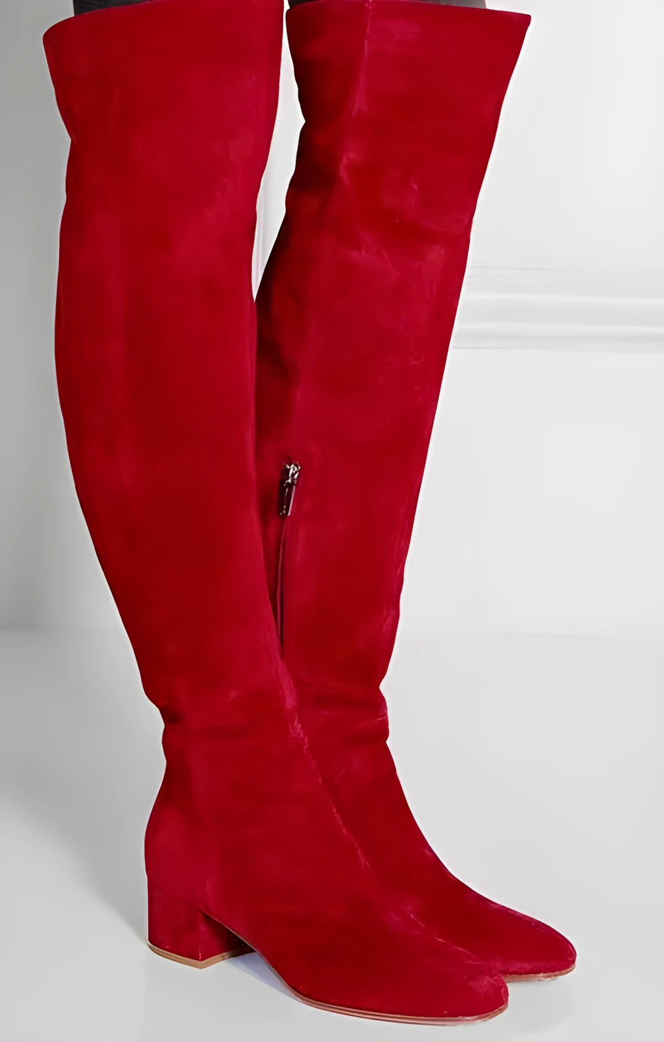 Grey women's flat over-the-knee suede boots with a pointed toe and low rubber heel.