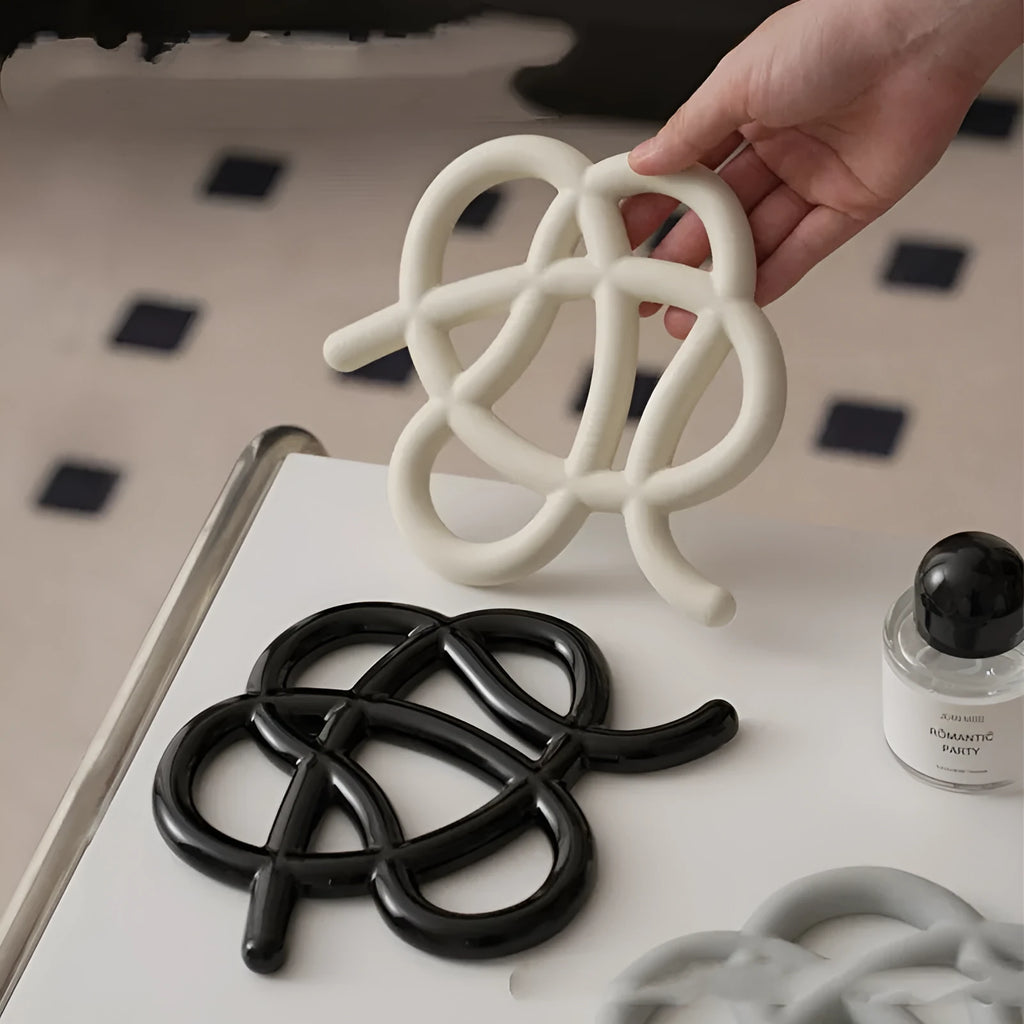 Ceramic heat proof mat with irregular shape and bend and hook design