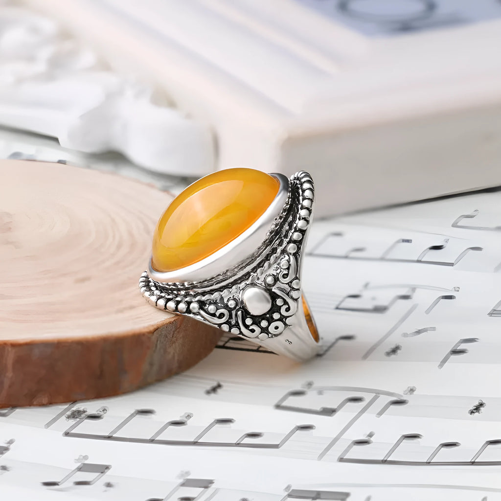 Geometric alloy ring with an antique silver amber electroplated finish.