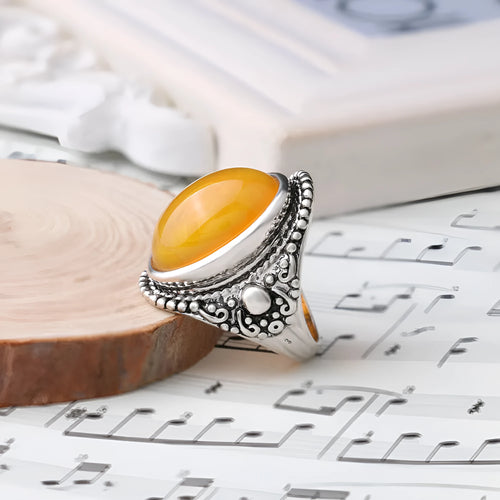 Geometric alloy ring with an antique silver amber electroplated finish.