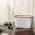 GX-22K white aromatherapy humidifier with night light and water tank on a wooden table.